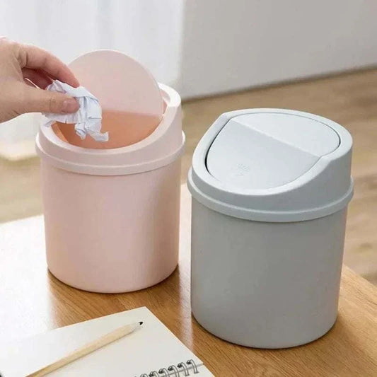 Mini Waste Bin set in pastel pink and gray plastic with a swing lid design for easy trash disposal on desktops and small spaces.