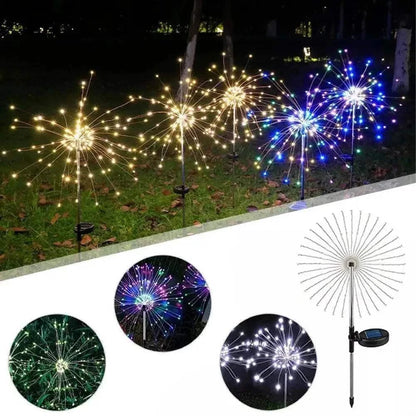 Dandelion Firework Lights in warm white and multicolour LED arranged outdoors on stakes with a solar panel, mimicking dandelion flower bursts