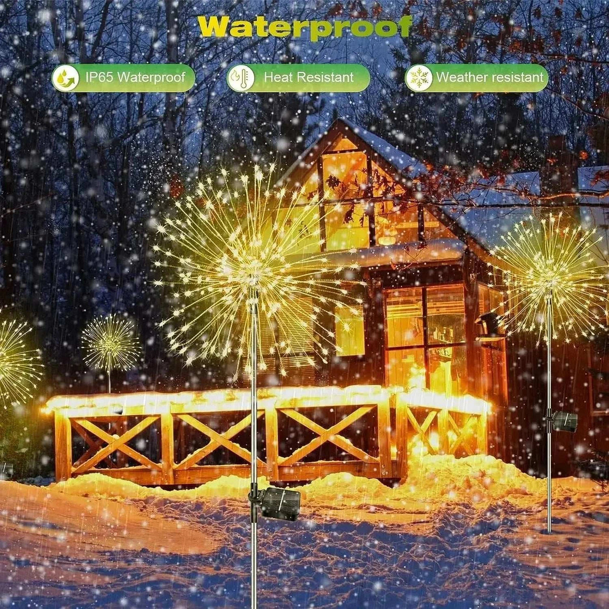 Dandelion Firework Lights in warm yellow glow with metal stems illuminating a snowy garden patio at night, waterproof and weather resistant