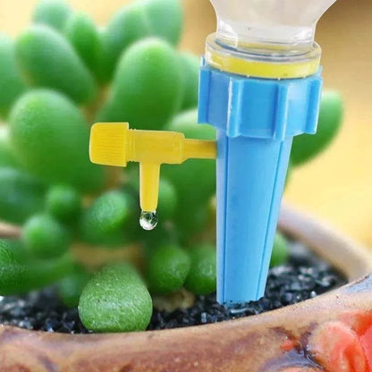 Flower Adjustable Drip Tool with blue stake and yellow adjustable nozzle releasing a water drop into a succulent pot