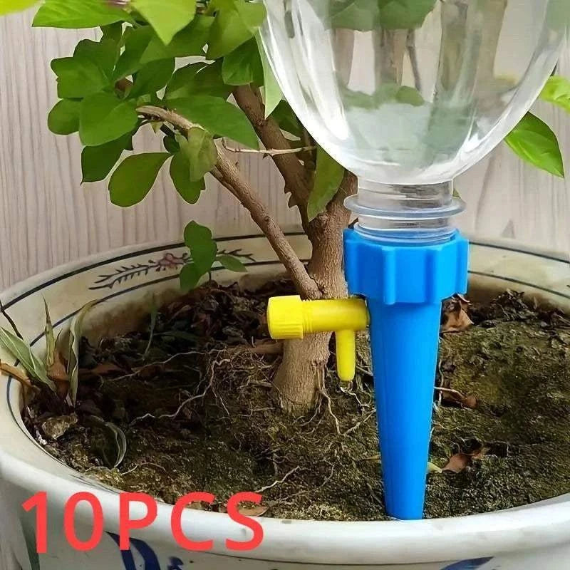 Flower Adjustable Drip Tool in blue and yellow plastic delivering water gradually to potted plant soil for controlled hydration