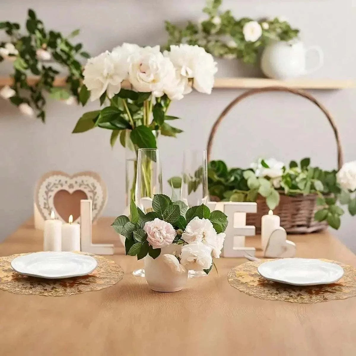 Leeseph Disposable Gold Placemats Set featuring round, gold-colored placemats with intricate floral patterns on a wooden table with white plates and floral centerpieces