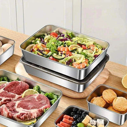 Stainless Steel Food Storage Container sets with square and rectangular shapes holding fresh salad, raw meat, blueberries, and biscuits